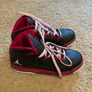Women’s Size 6 Nike Micheal Jordan’s, colors are black and pink